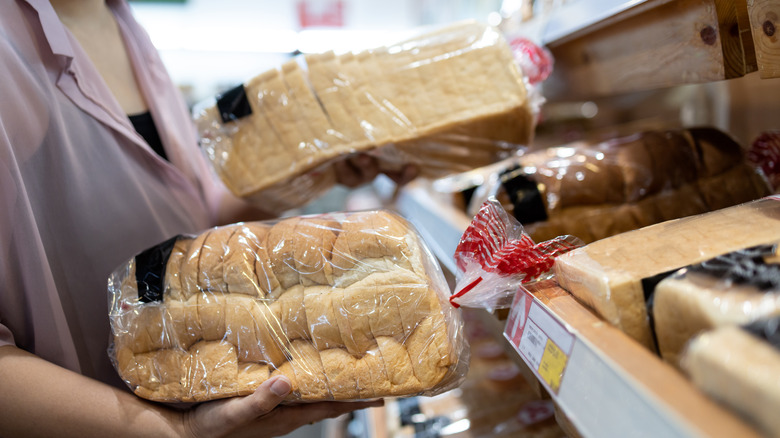 woman comparing bread