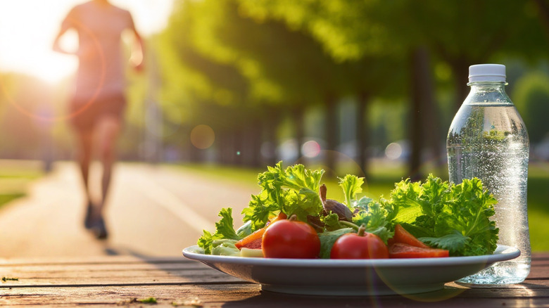 Person running in the sun with a healthy salad waiting on them for afterward