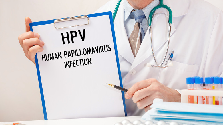 Doctor holding HPV chart