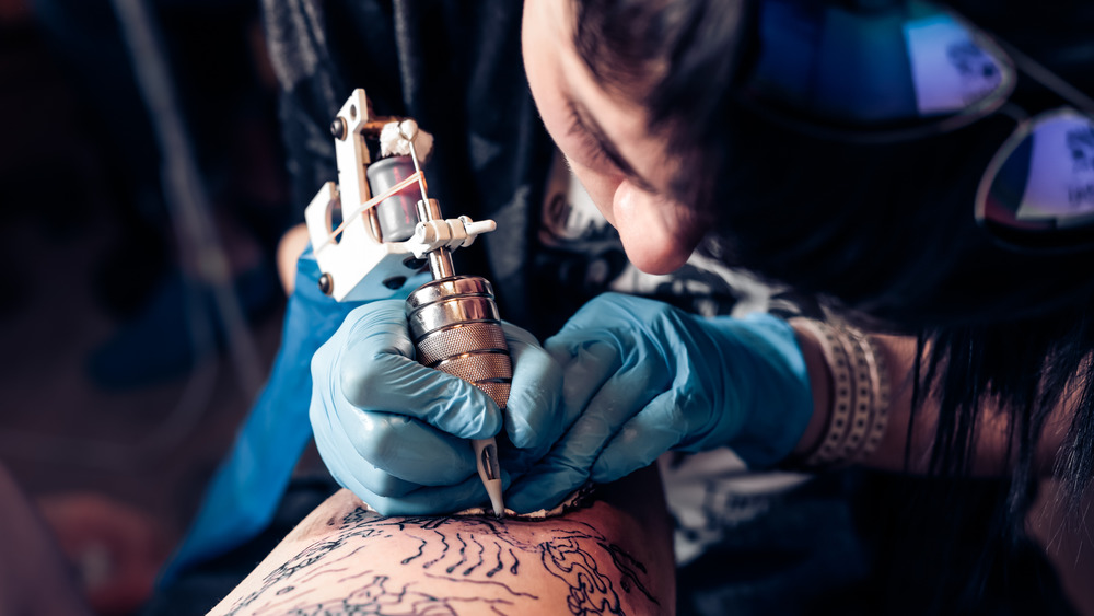 Close up of a tattoo artist working 