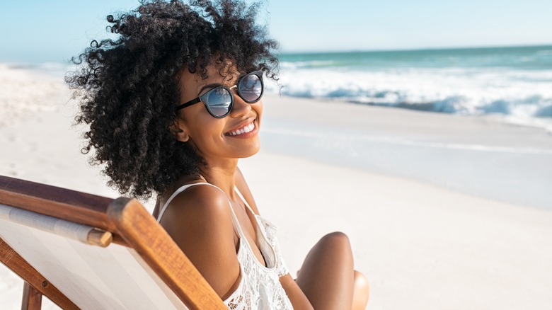 woman with sunglasses at beach
