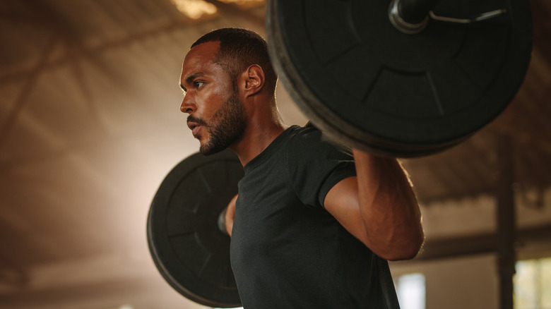 Man lifting weights bodybuilder 