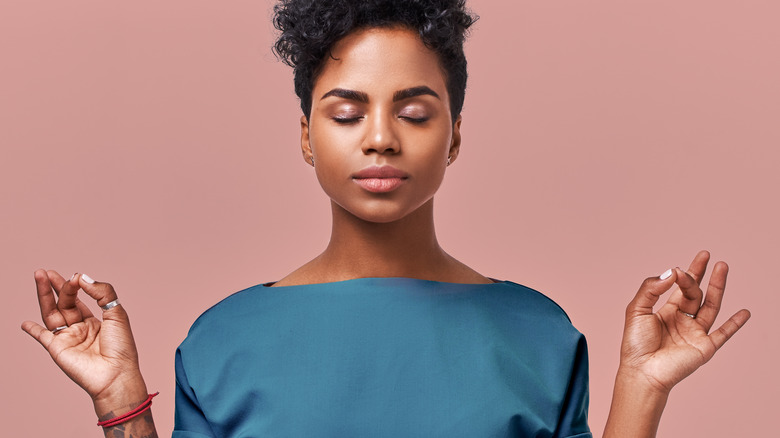 Black woman with her eyes closed at peace