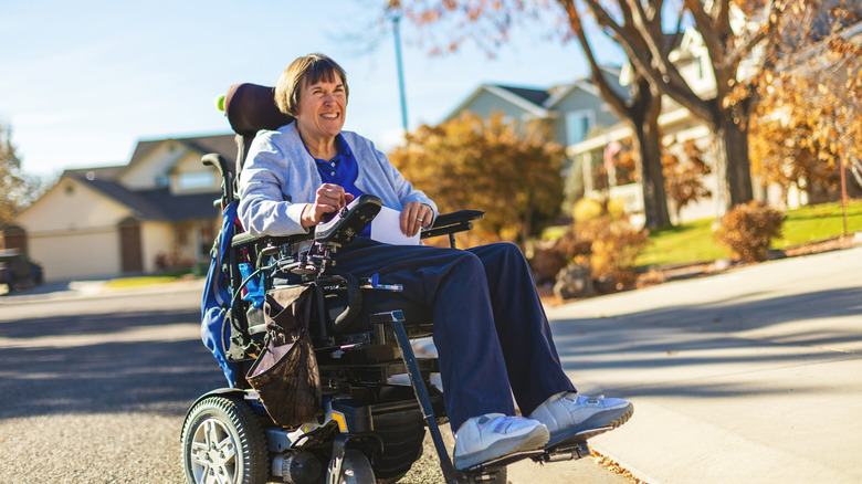 smiling woman in a wheelchair 