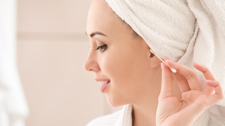 Woman using q-tip