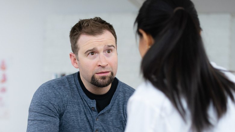 A male patient listening to his doctor