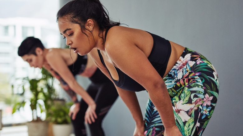 Individual bent over during work out