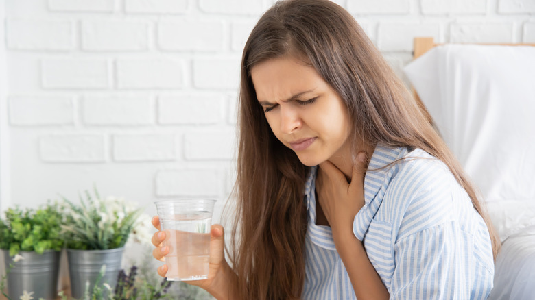 Woman experiencing hiccups