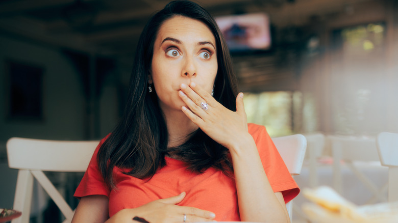 Woman burping after eating