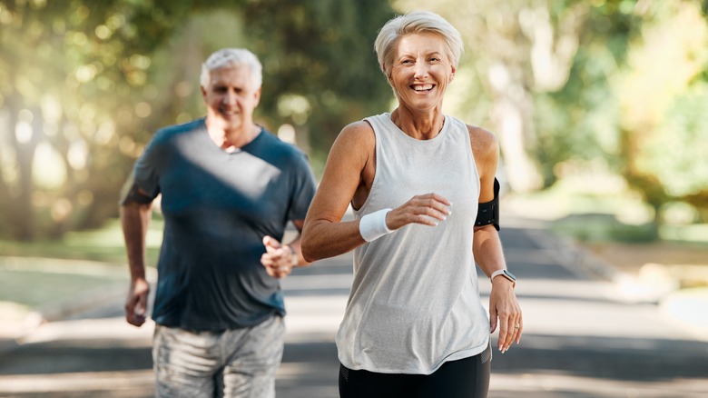 older couple running in the park