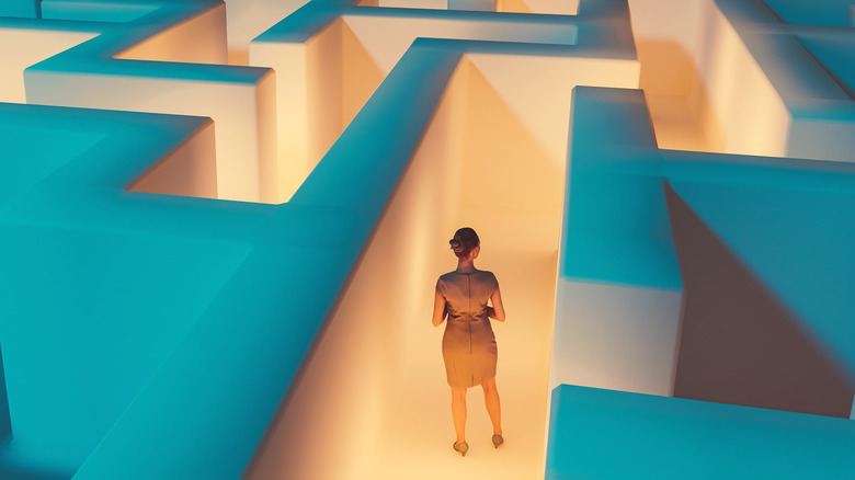 woman standing in a graphical maze
