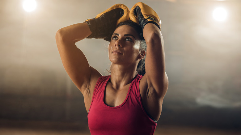 Woman frustrated in boxing gym