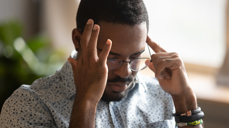 Man rubbing temples