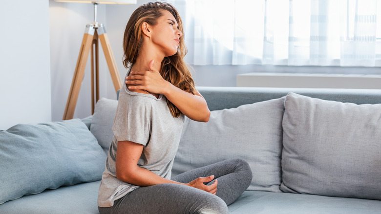 woman having upper back pain