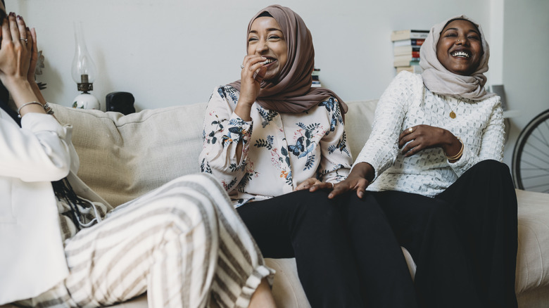 Three women laughing