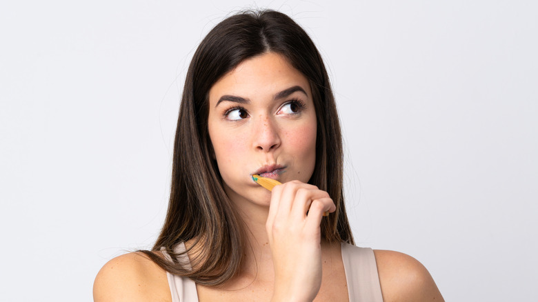 woman brushing her teeth