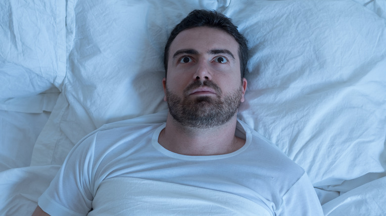 worried man in bed