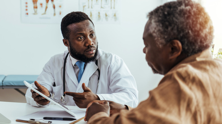 Doctor speaking with patient