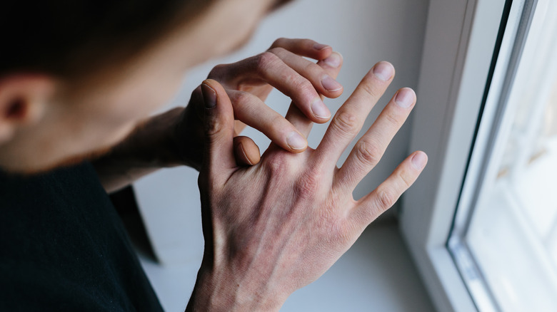 person looking at hand