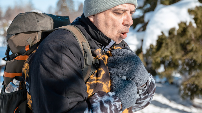 man in pain in cold weather