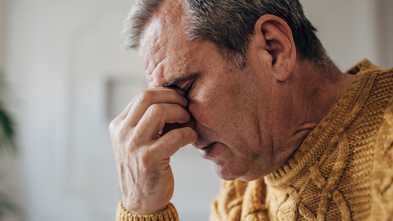 Elderly man with nose pain