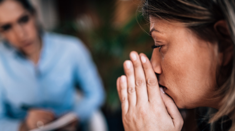 Mental health counselor listening to a concerned patient