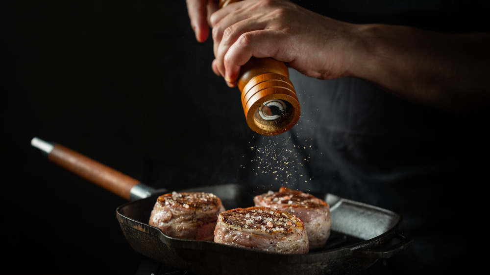 chef seasoning meat