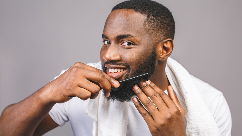 a man combing his beard