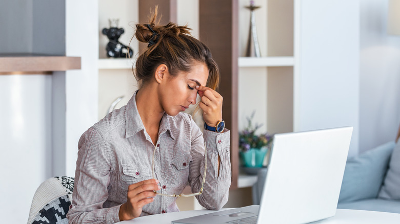 Woman at work has a headache