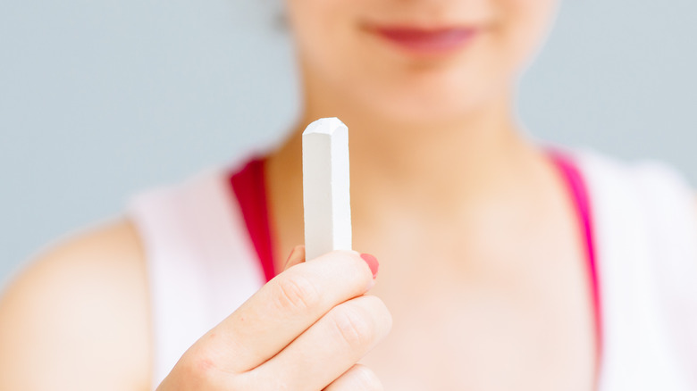 woman looking at chalk