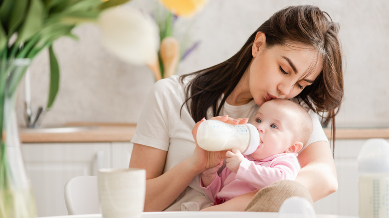 Woman feeding her baby