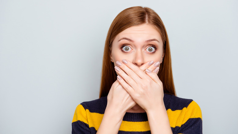 Girl shutting mouth