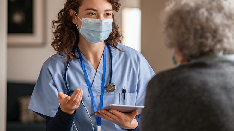 Elderly person visiting doctor