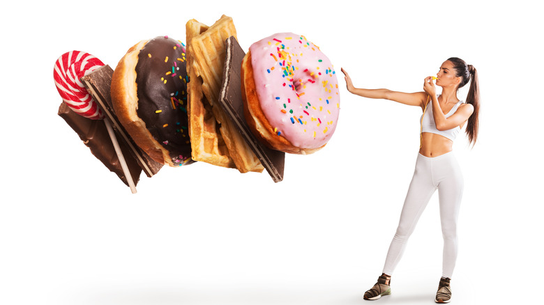 concept of a woman being strong enough to beat her sugar cravings 
