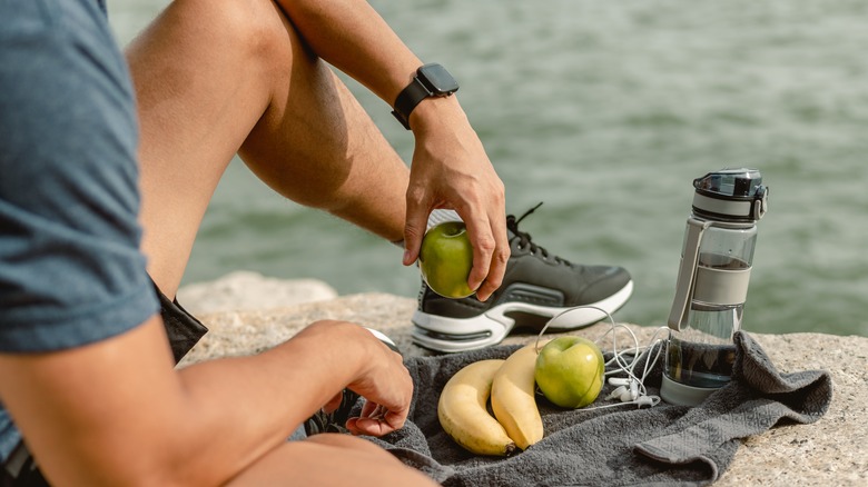 Man with snacks and water bottle