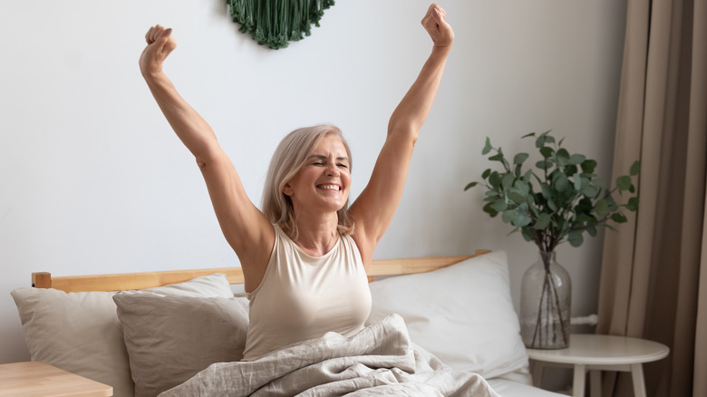 Happy woman waking up