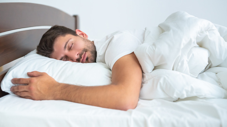 Man sleeping on mattress