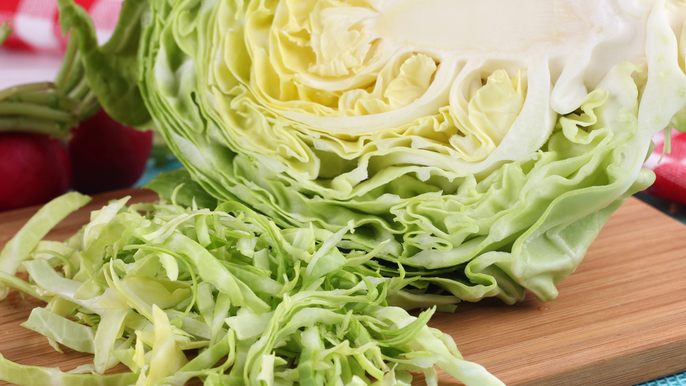 Shredded cabbage on cutting board