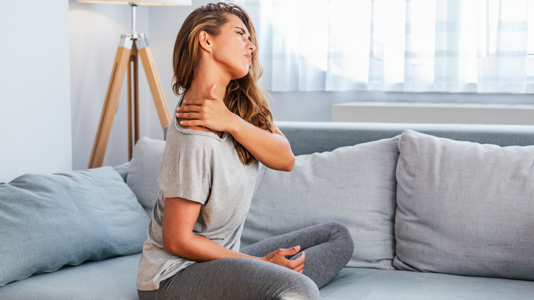 woman having upper back pain