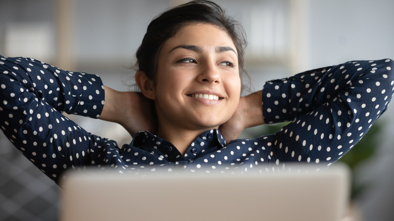 Woman relaxing at desk