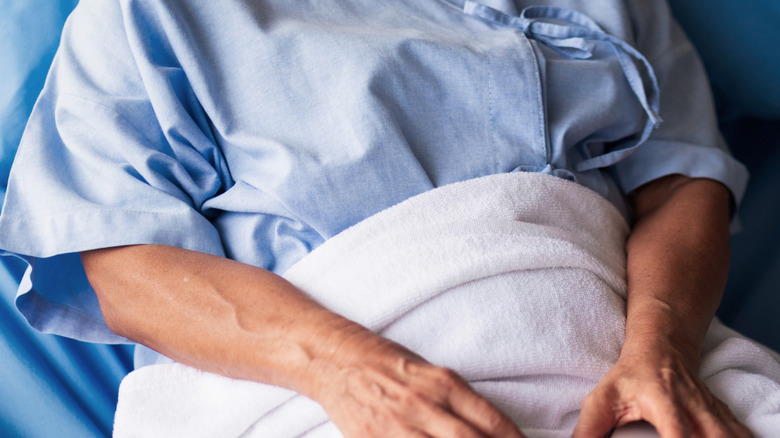 female patient in a bed in a hospital room