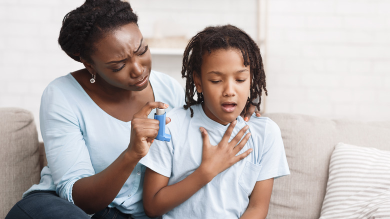 young girl having problems breathing