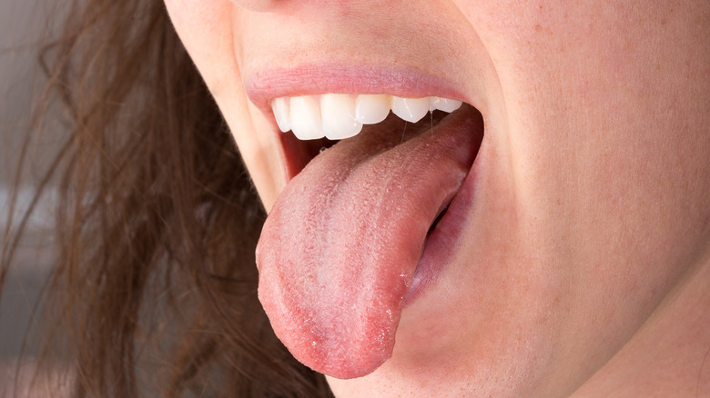 Close up on chin of a person sticking out their tongue