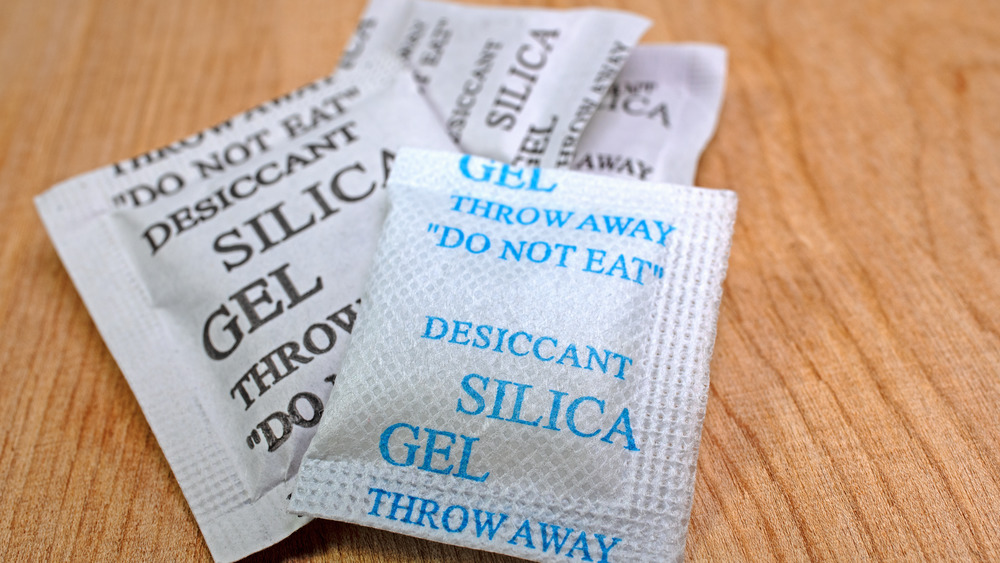 Silica gel packets on wood