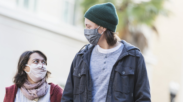 Woman walking with tall man