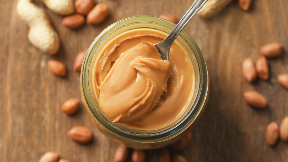 spoon and jar of peanut butter