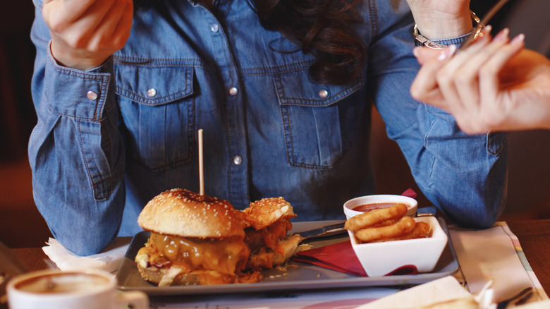 woman eating burger