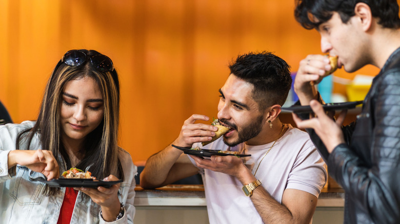 friends eating meat