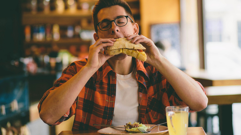 man eating sandwich