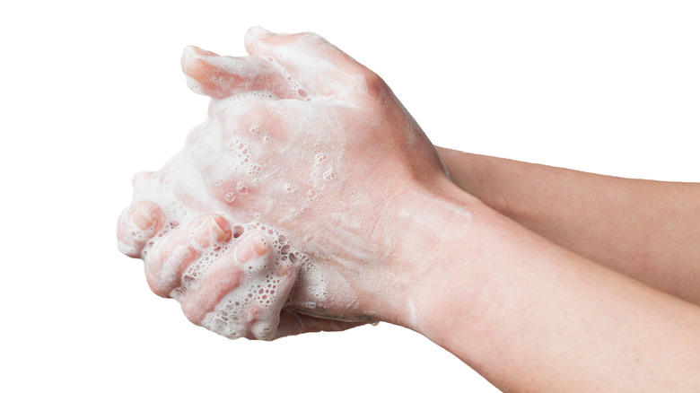 Hands washing up close